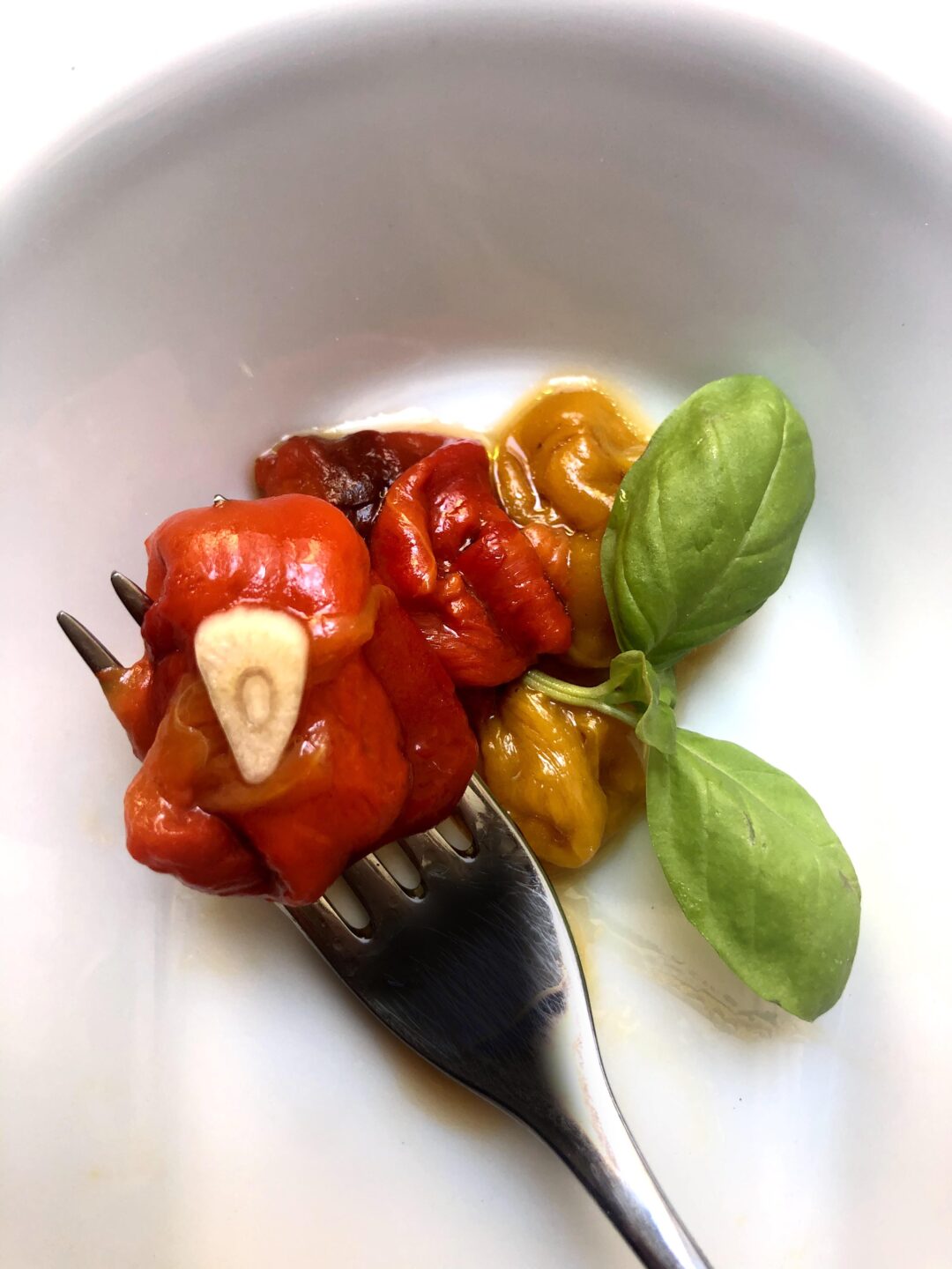 bell peppers wrapped on a forrk in a dish italian cooking tips