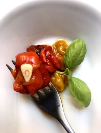 bell peppers wrapped on a forrk in a dish italian cooking tips