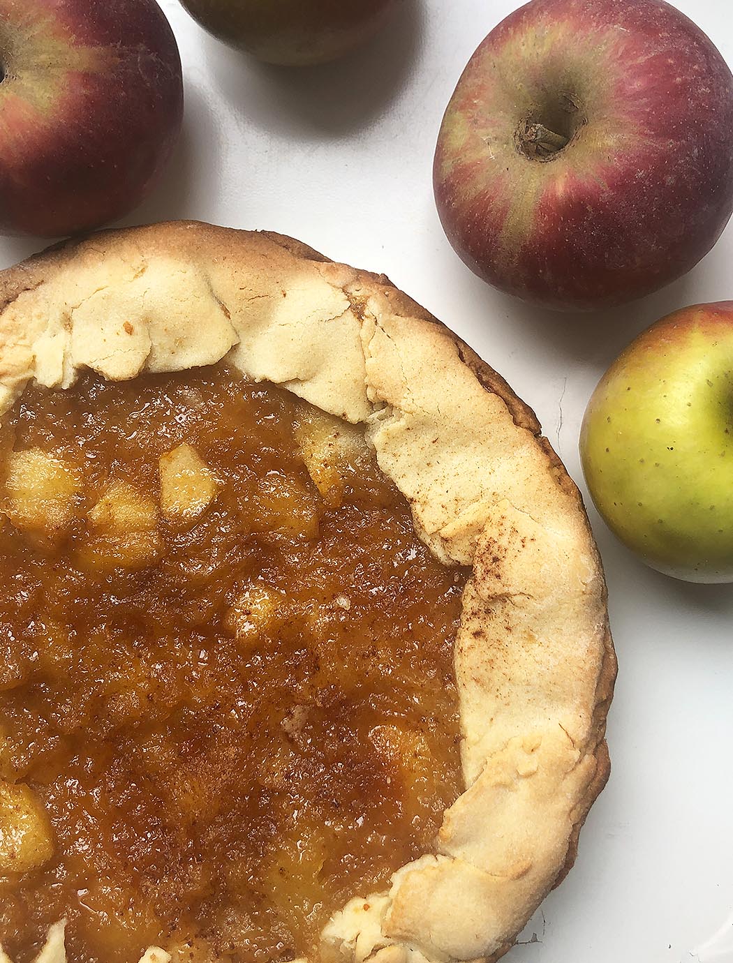 "crostata" cake with caramelized on a white background with apples fruitsapples italian cooking tips
