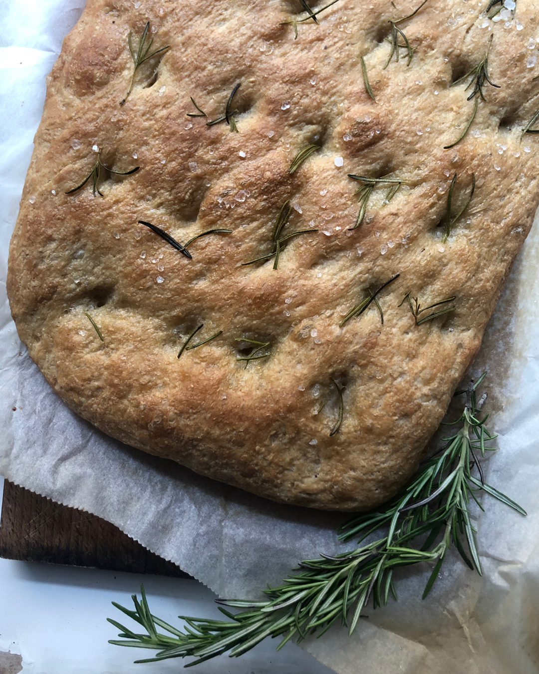 focaccia on a cutting board with roremary Italian cooking tips