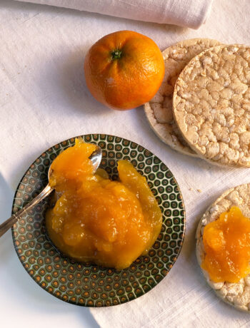 late mandarin marmalade with fruit, bread and a dish