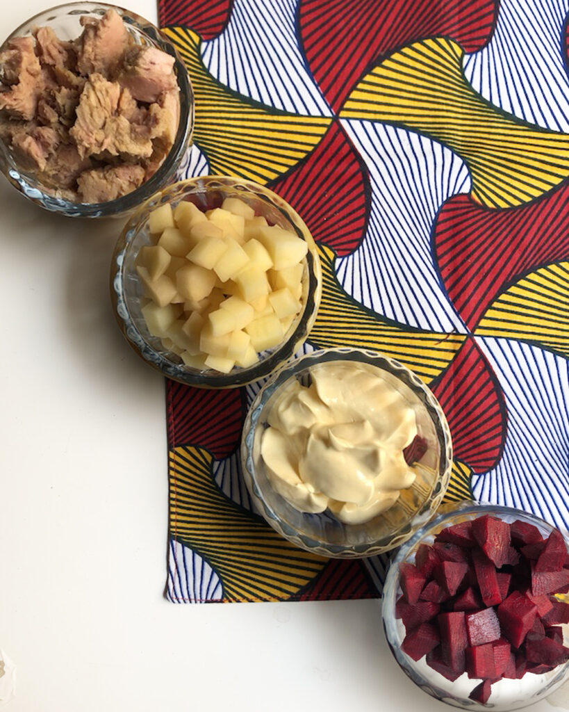 tuna, potatoes, mayonnaise and beet in 4 different bowl with a napkin Italian cooking tips