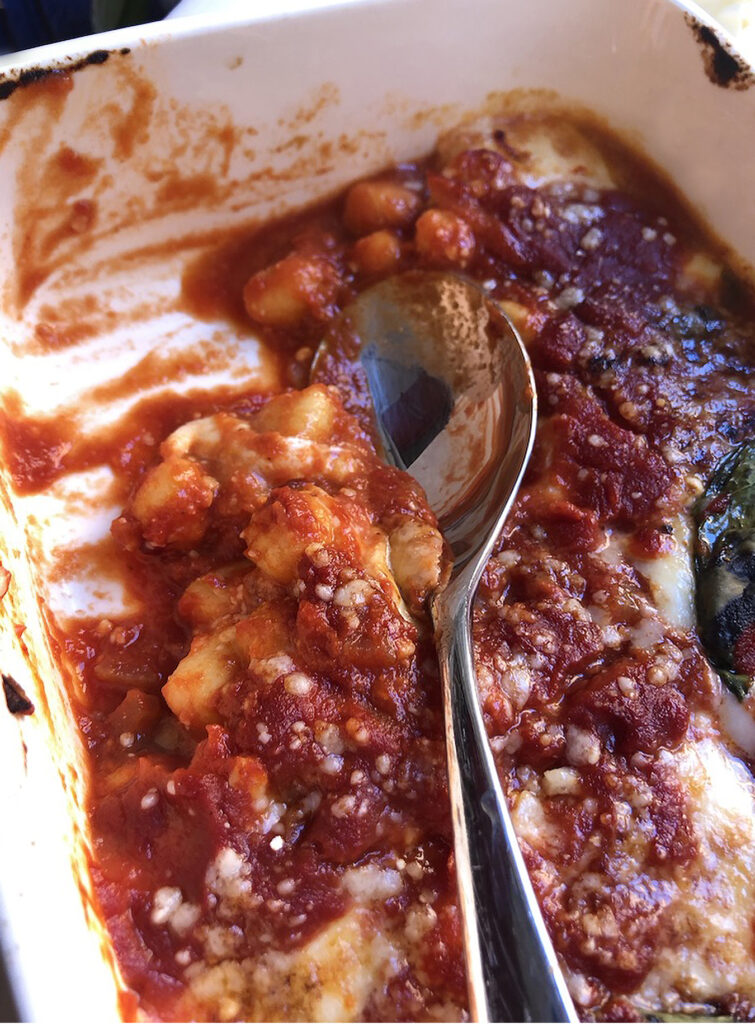 gnocchi alla sorrentina on a oven pan with a spoon