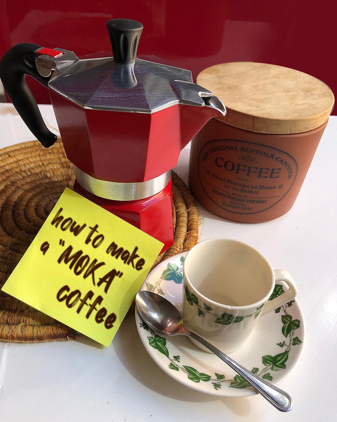 "moka" coffee maker, coffee and a coffee cup