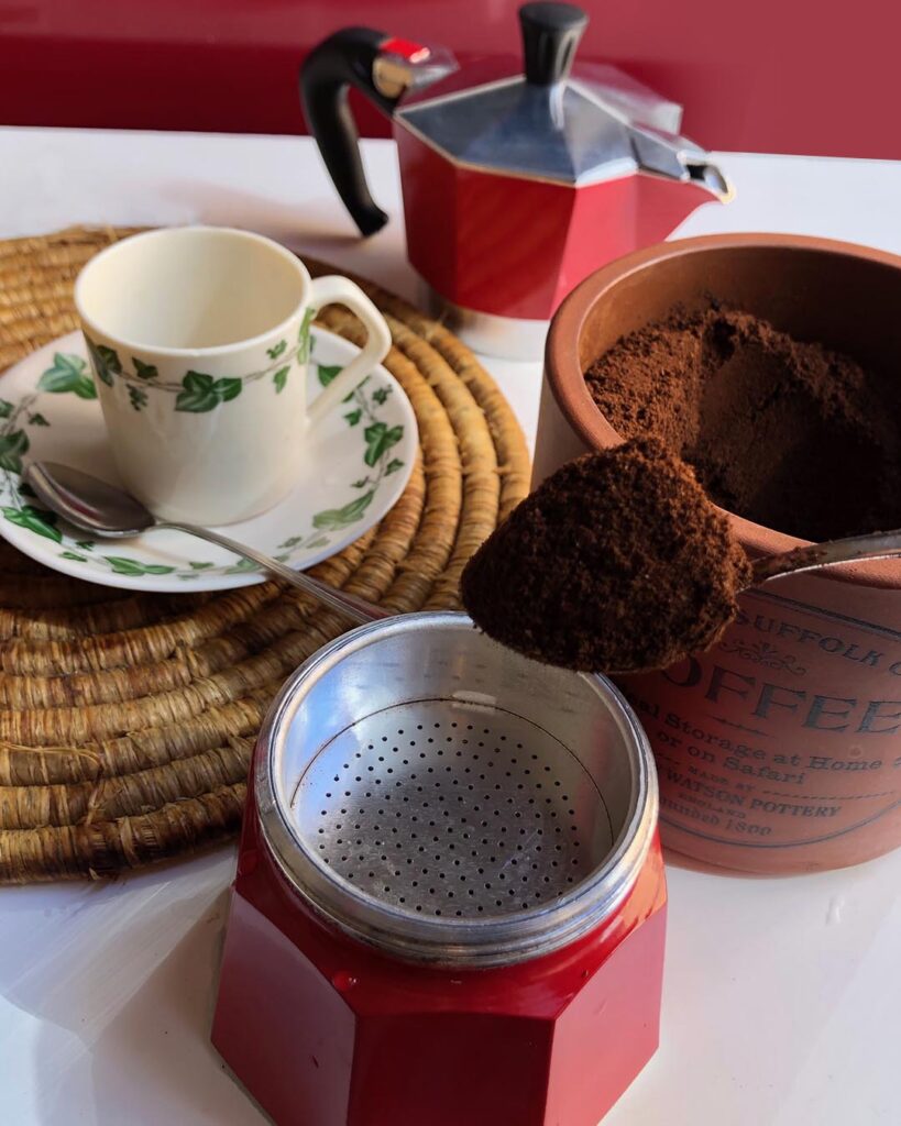 putting coffee into "moka" coffee maker