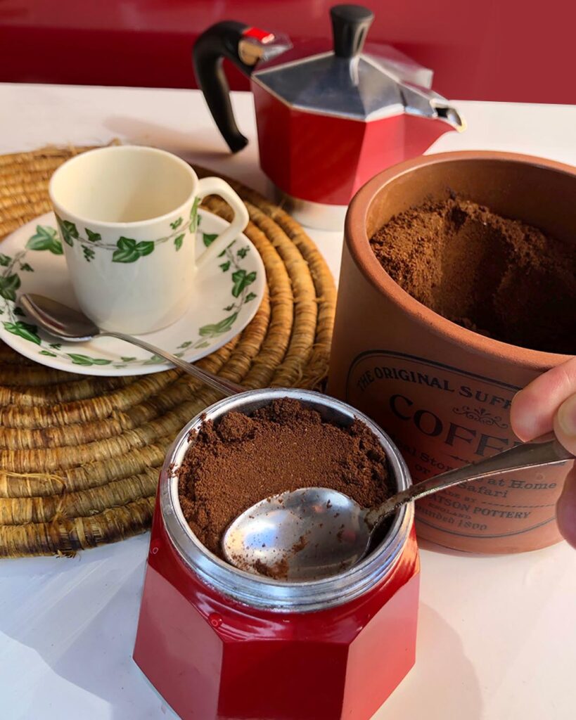 putting coffee into "moka" coffee maker