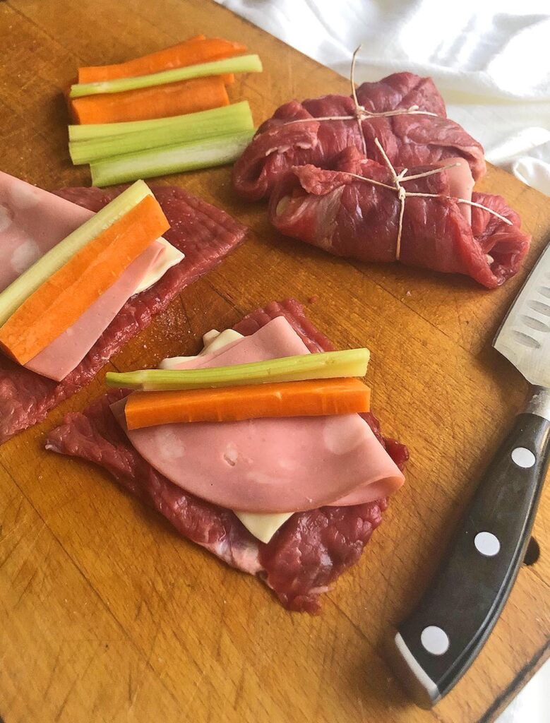 slices of meat, mortadella and cheese to prepare meat rolls
