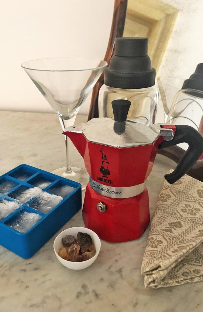 a moka and the ingredients for shaken coffee: coffee, ice and raw sugar crystals