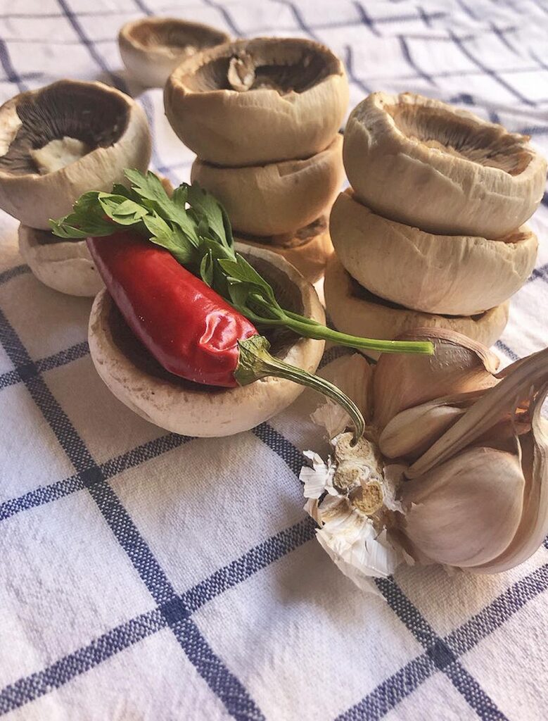garlic, parsley and chili pepper with champignons