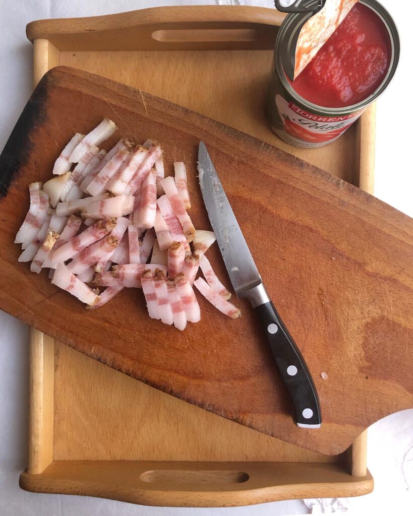 pork chopped in sticks on a cutting board