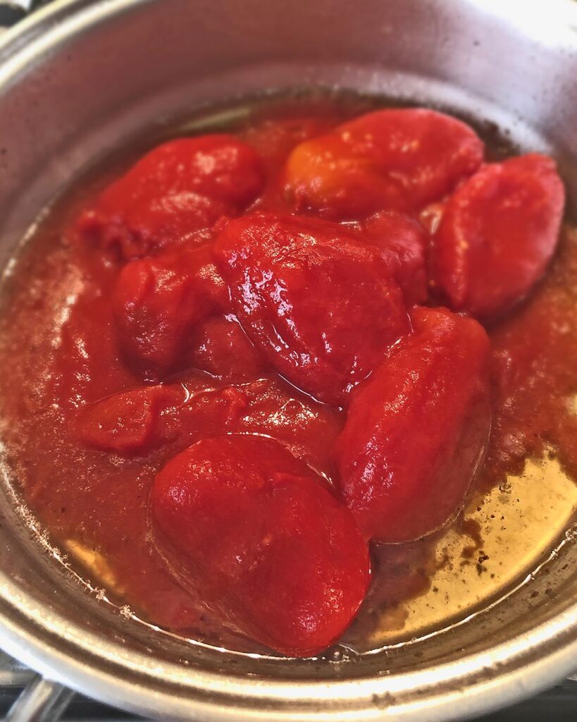 tomatoes cooked into a pan