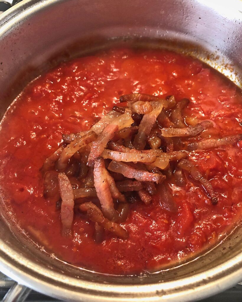 pork sticks added to the tomato sauce