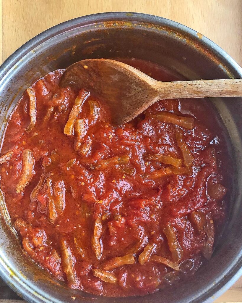 mixing the Amatriciana sauce after the cooking