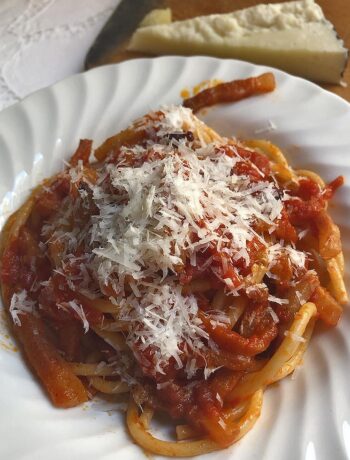 Bucatini alla amatriciana served in a white plate