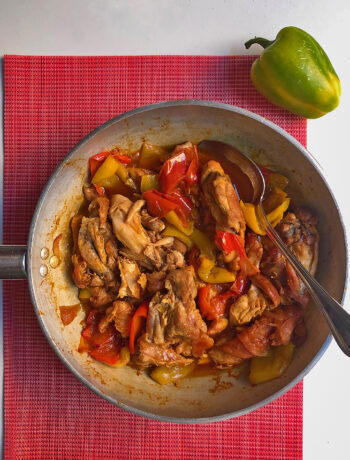 a pan full of chicken with bell pepper ready to be taste