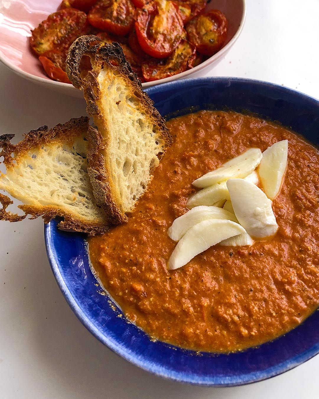 roasted tomato soup served with mozzarella pieces and rasted bread
