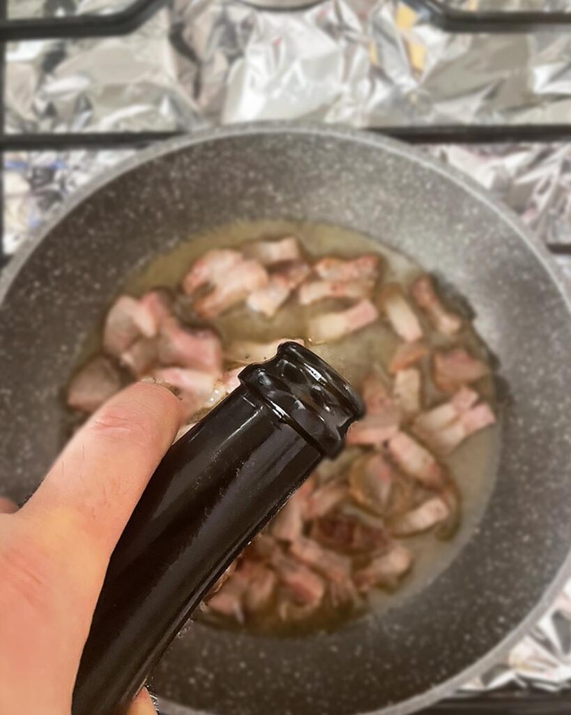 adding some wine to the pork