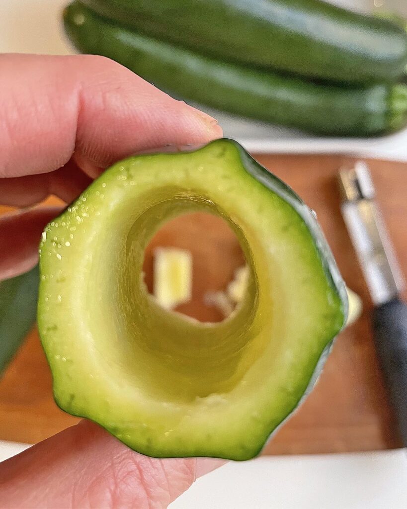 Close up of a zucchini scooped out to be. stuffed