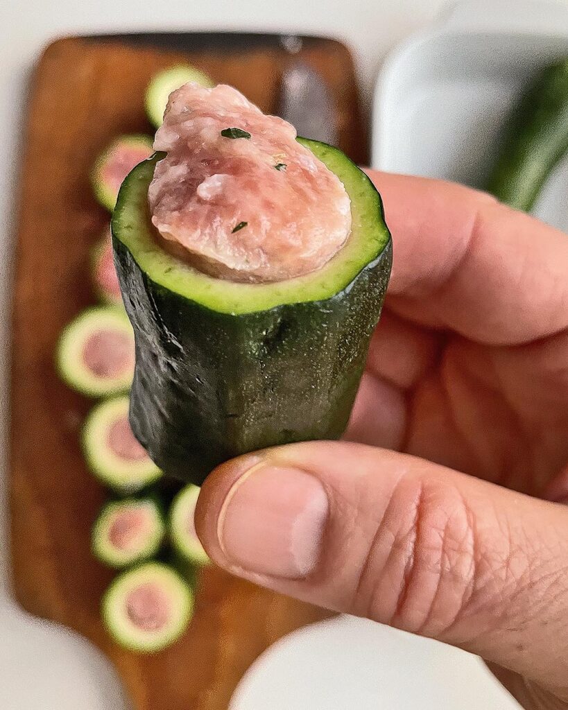close up of a stuffed zucchini ready to be cooked