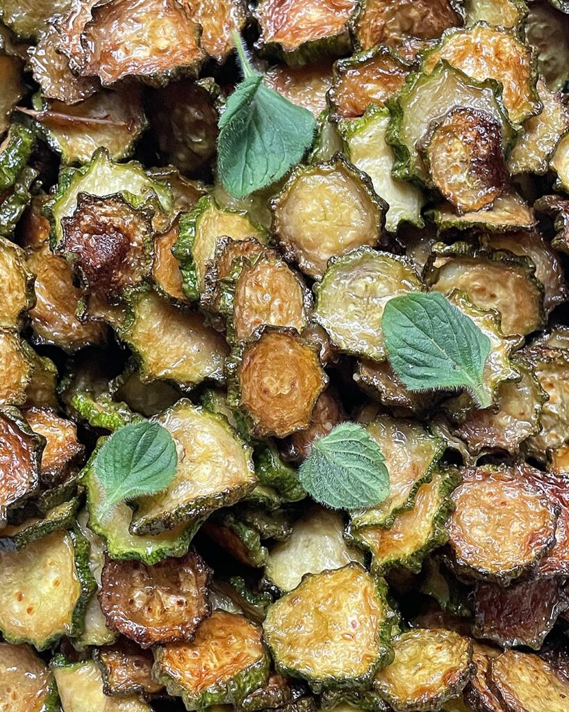 close up of zucchini with roman mint leaves