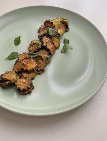 fried zucchini served in a green dish
