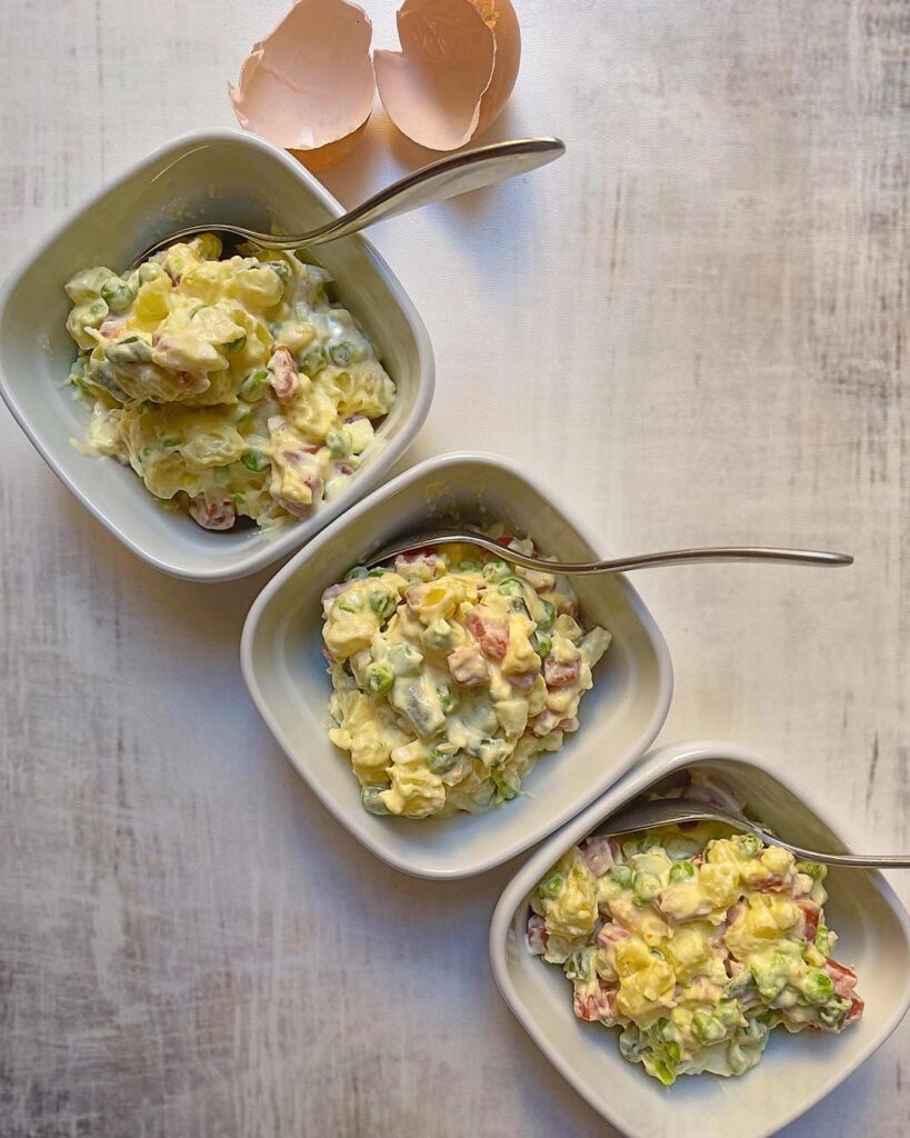 insalata russa served in 3 different withe cups