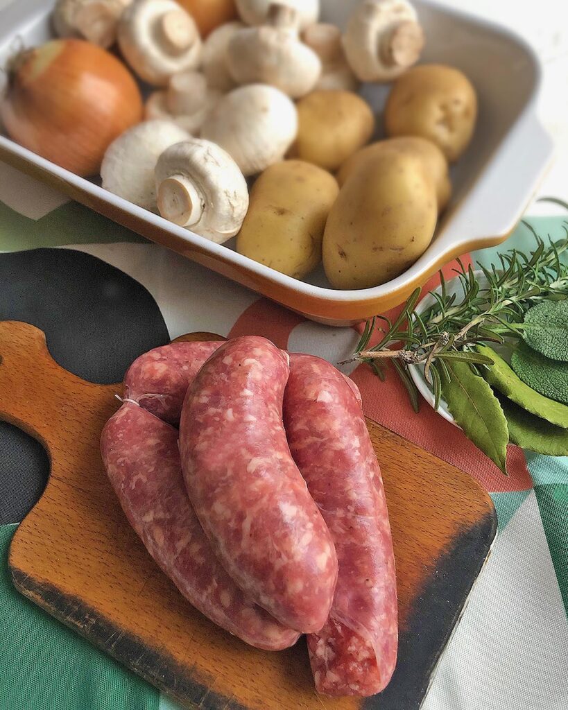 sausages, potatoes, mushrums, onions and fresh aromatic herbs