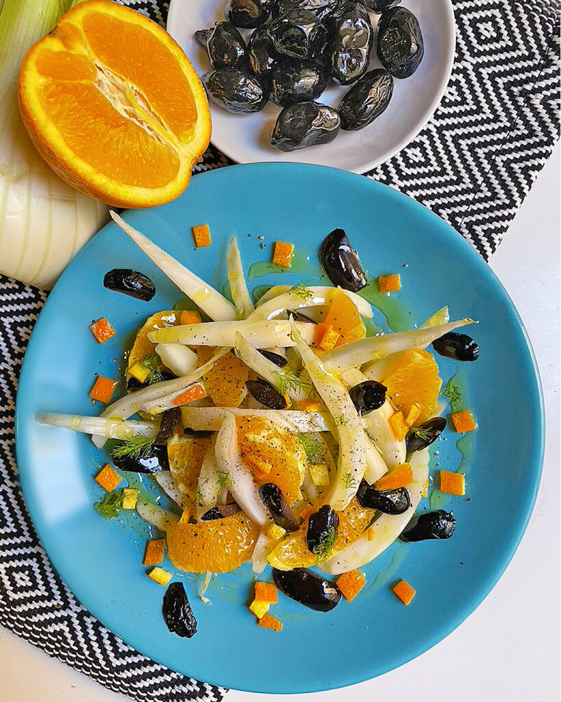 fennel and orange salad served on a blue dish