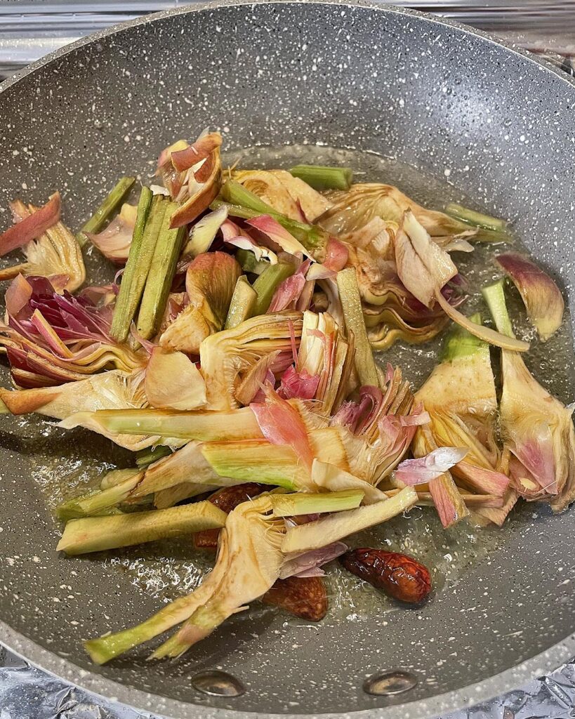 cooking artichokes in oil, garlic and peperoncino