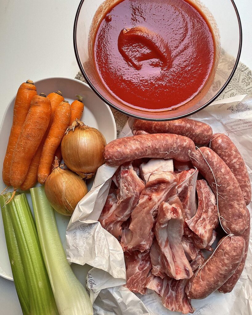 all the ingredients pork ribs with polenta: ribs, sausage, carrots, celery, onion, tomato passata