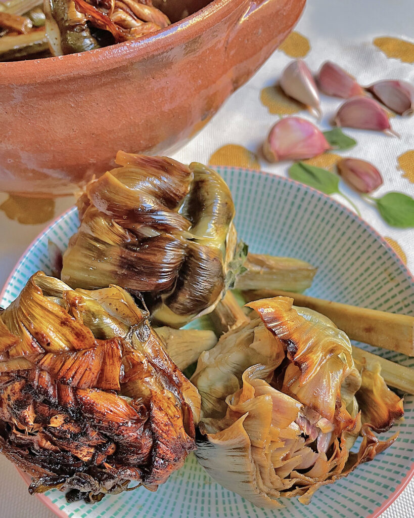 artichoke roman style served on a green dish