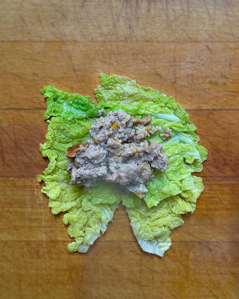 putting the dough on a cabbage leaf