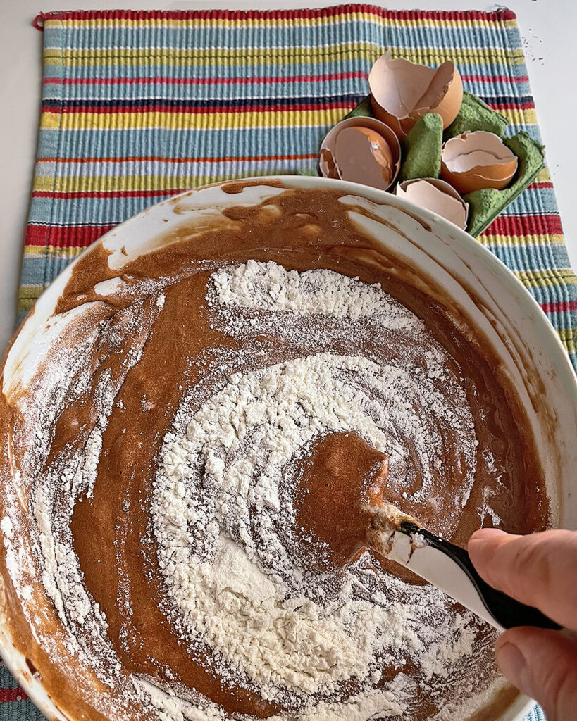 whisking flour to chocolate