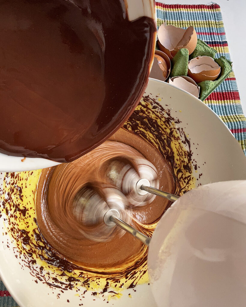 blending together egg whites and egg yolks