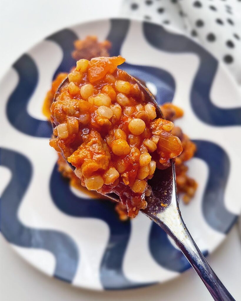 close up of fregula in a spoon