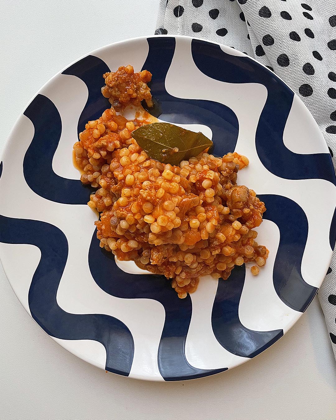 fregola with tomato and sausage sauce