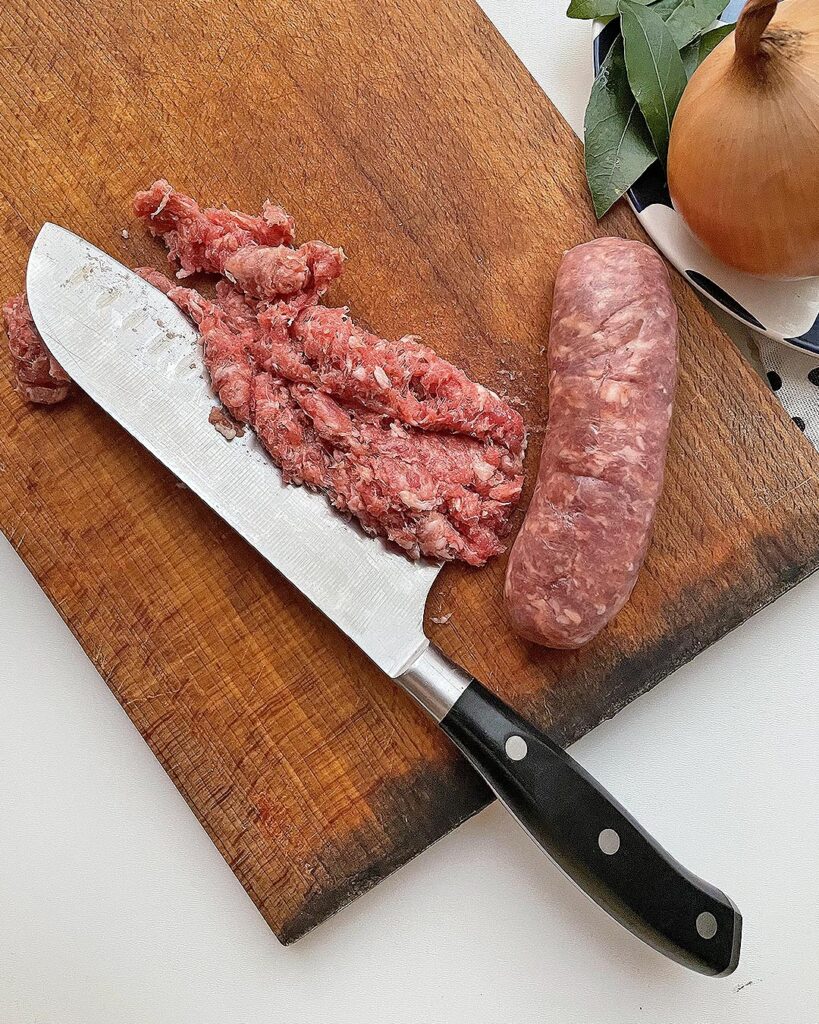 chopped sausage on a chopping board
