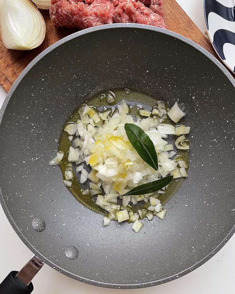 cookint onion and bay leaves