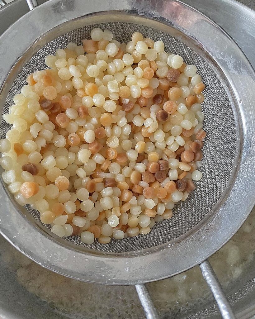 fregula drained off from the boiling water
