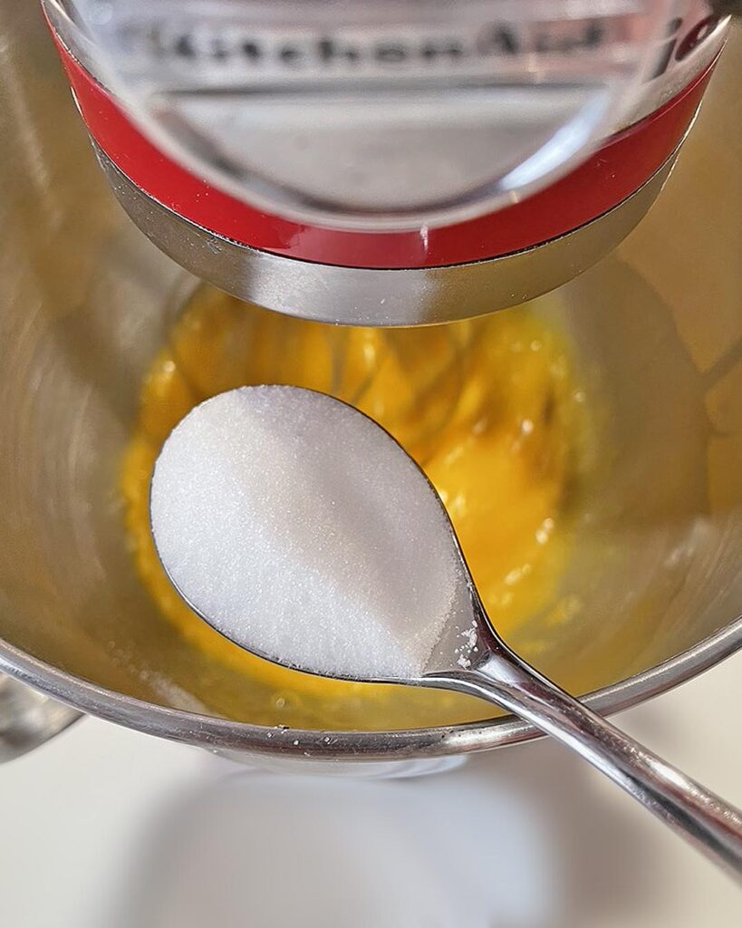 adding sugar to whipped eggs