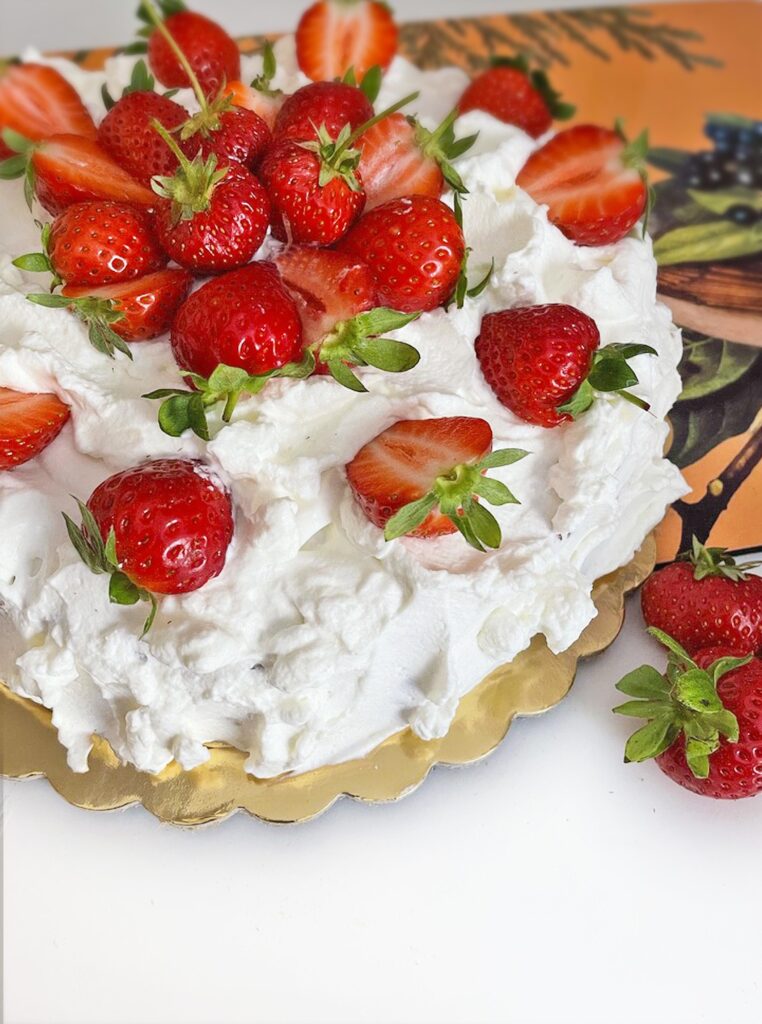 layer cake made with Pan di Spagna and topped with whipped cream and strawberries