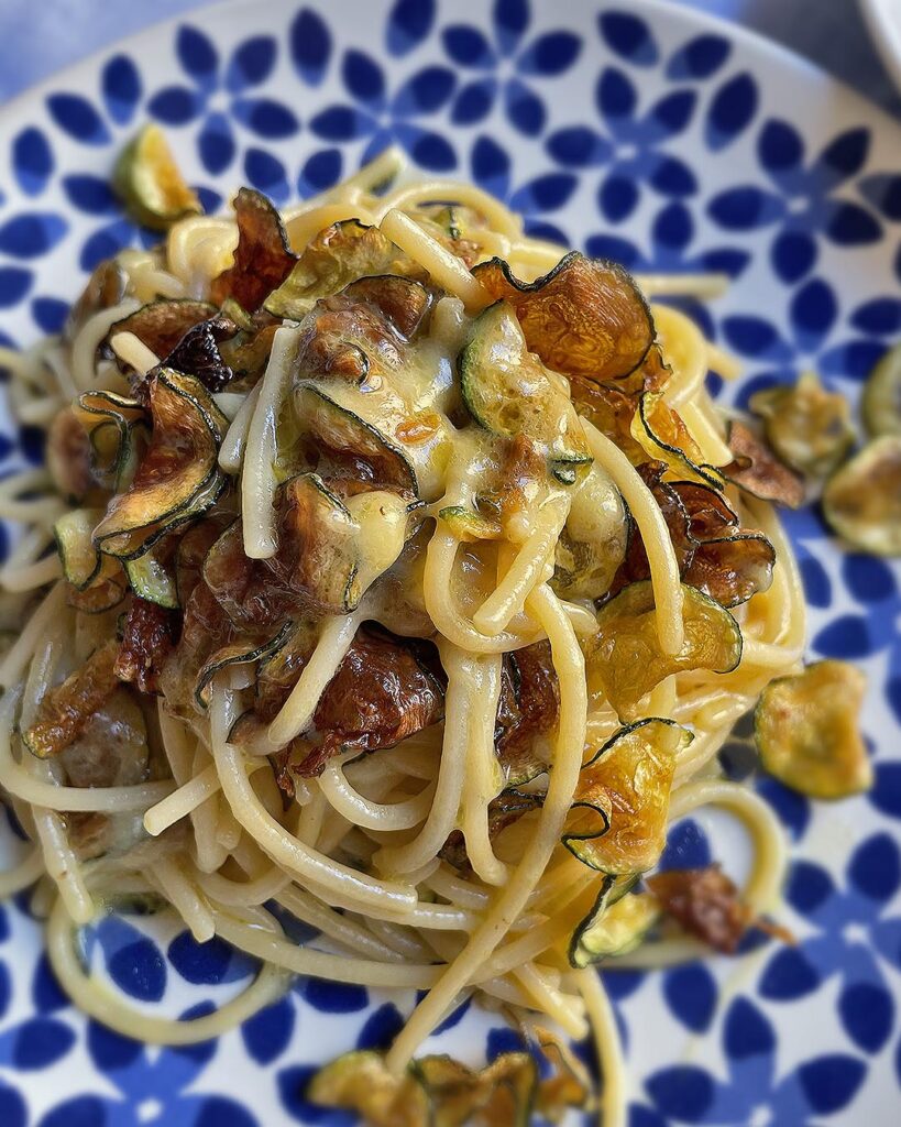 close up of spaghetti alla nerano served on a dish