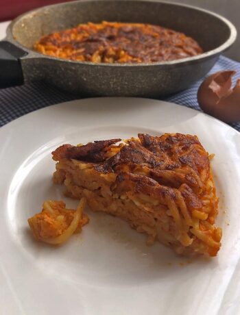 a slice of frittata di pasta on a white dish